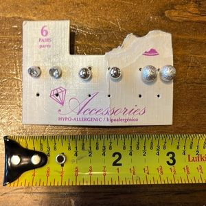 3 pairs silver tone metal. earrings. Never worn. Listing #7000